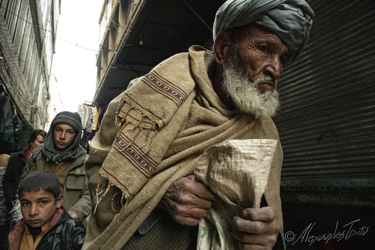 Afghanistan old man bird market